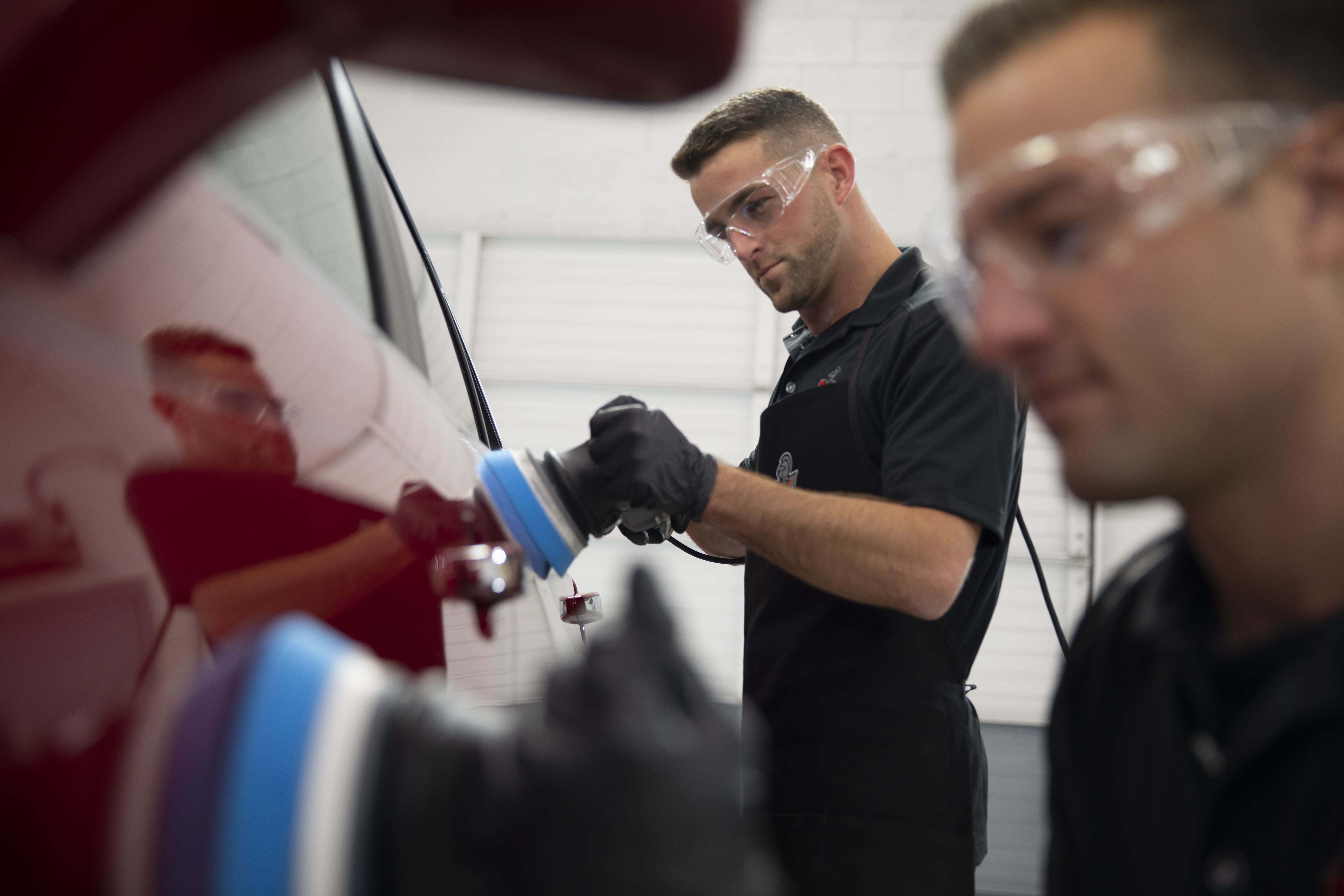Ziebart technician performing paint correction